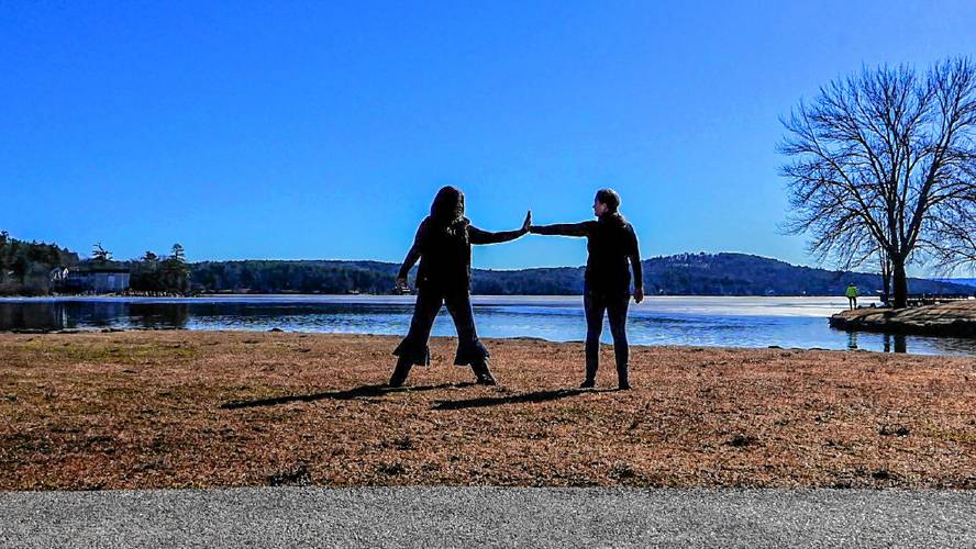 Stephanie Whitney, Director of Unbound Dance Academy in Hookset (left), and Gaynelle Gosselin, Co-Founder of See Change Dance (right) rehearse beside Meredith Bay in preparation for National Water Dance 2024. Courtesy.