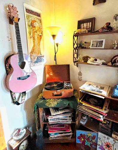 Musician Kate Schimke’s vinyl collection with her pink guitar.