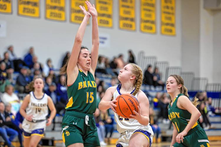 Bow junior Bryana Szepan tries to create an angle for a shot with Bishop Brady’s Claire Jackson defending her during Friday night’s 51-29 win for the Falcons.