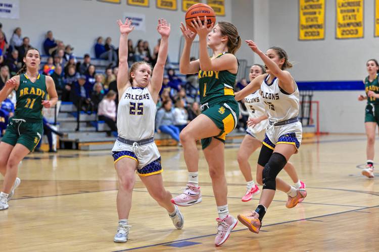 Bishop Brady senior Mia Wagner prepares to float up a shot with Bow’s Bryana Szepan (25) and Juliette Tarsa converging.