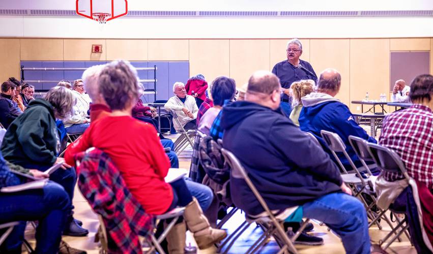 Allenstown resident Ron Adinolfo speaks to the crowd at the elementary school on Saturday in favor of moving back to the traditional town meeting format rather than the SB2 dual sessions.