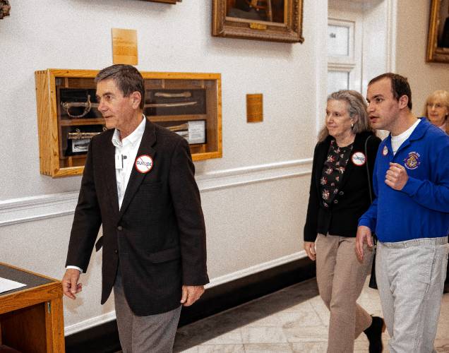 Phillip Kaneb walks into the hearing room with his parents, Stephen and Andrea, as they get ready to testify against HB 1283 in the afternoon session at the State House on Wednesday.