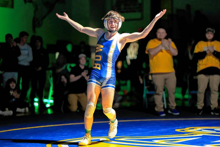 Bow senior Adler Moura celebrates after winning the 113-pound title at the Division III state wrestling championships on Feb. 17.
