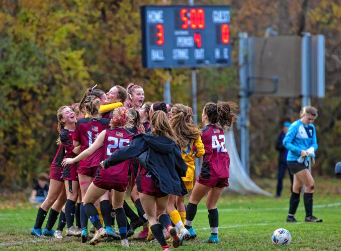 The Concord High girls’ soccer team celebrates after beating Nashua North in a penalty-kick tiebreaker during a first-round Division I tournament match on Oct. 25 at Memorial Field.