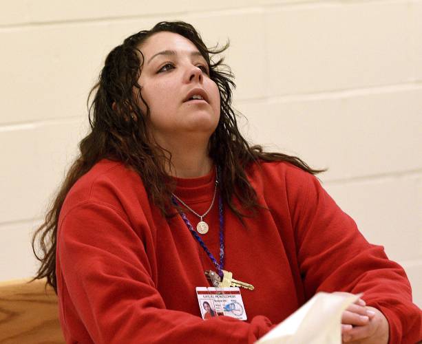 Kayla Montgomery reacts to a question from the parole board at the New Hampshire Correctional Facility for Women in Concord, N.H., on Thursday, March 7, 2024. Kayla Montgomery, the estranged wife of Adam Montgomery, convicted of killing his 5-year-old daughter and moving the body around for months, has been granted parole more than a year after she was sentenced to prison for lying about where she was when the child was last seen. (David Lane/Union Leader via AP, Pool)