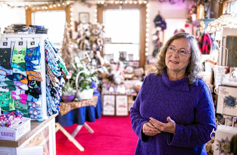 Lorrie Carey, owner and operator of Marshall’s Florist in Boscawen, in the entry way of the store on Thursday, November 16, 2023. The florist will be closing down in the new year.