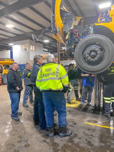 First responders being trained how to handle accidents involving electric vehicles at a Student Transportation of America site in Connecticut. 