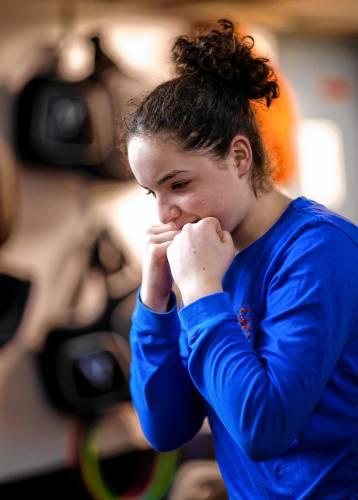 Ada Sansone warms up for her boxing class with her dad, Ken, at the Averill's Boxing in downton Concord on Thursday, March 7, 2024.