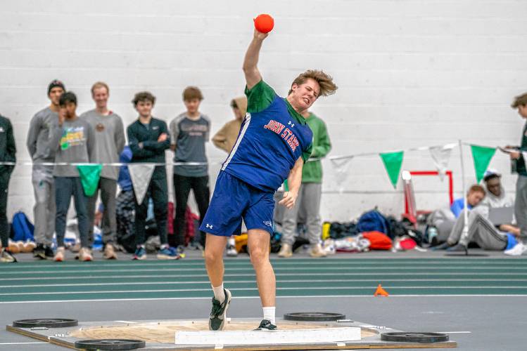 John Stark’s Joel Douzanis throws the shot put at the NHIAA Division II indoor track & field championships on Sunday at Plymouth State. Douzanis won the event with a toss of 47 feet, 2.5 inches, to lead John Stark to second place as a team.