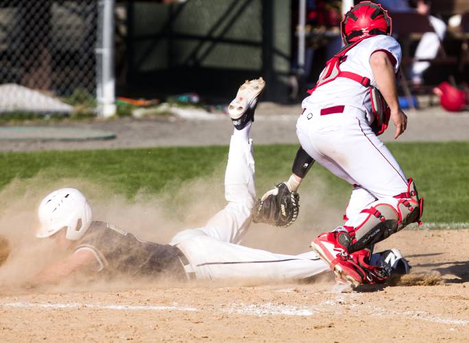 Windham center fielder Vince Folco slides under the tag of Concord catcher Isaac Vaillancourt in the sixth inning on Wednesday.
