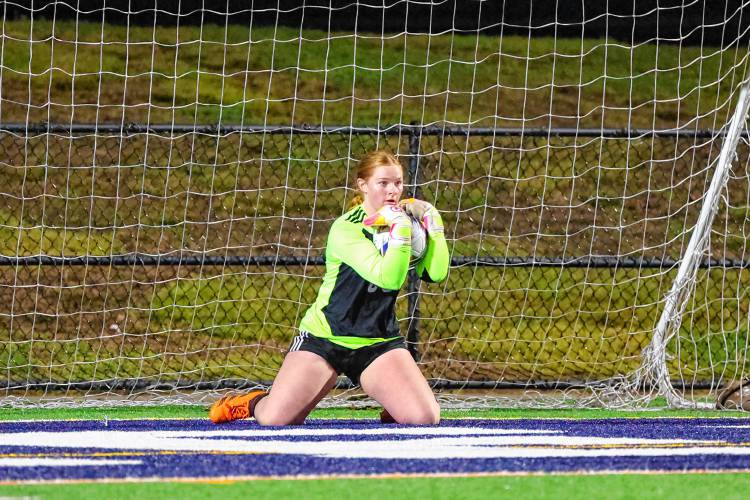 Coe-Brown goalkeeper Sadie Scruton secures a save in the Division II championship game against Hollis-Brookline on Sunday.