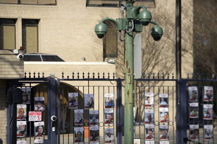 Security cameras are mounted on a pole outside the entrance of the Israeli Embassy, Monday, Feb. 26, 2024, in Washington. An active-duty member of the U.S. Air Force has died after he set himself ablaze outside the Israeli Embassy in Washington, D.C., while declaring that he 