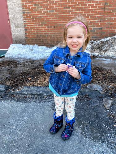 Ivy Fioretti, 3, holds a 