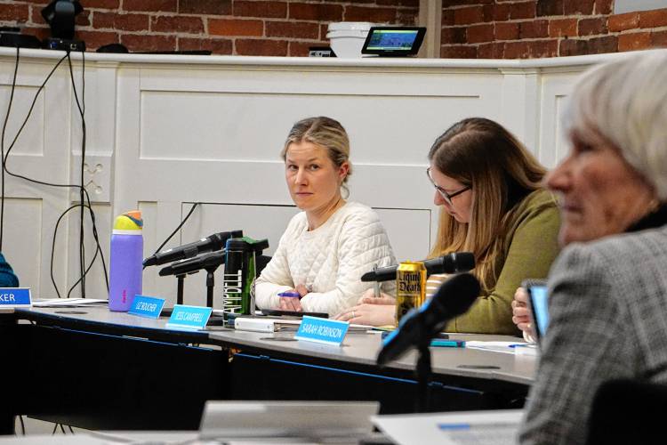 New board member Liz Boucher, left, noted her support for the budget within the context of falling aid from the state. “With less and less state monies supporting our students, districts are left to pick up the mandated and forgotten costs of student population increasingly requires,” she said.