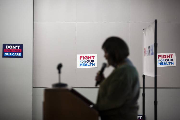 California’s Medicaid program pays for the in-home care that Cynthia Williams provides for her sister, a military veteran with post-traumatic stress disorder, and her daughter, who is blind. Williams spoke at a town hall meeting in Tustin, California, on Feb. 20, 2025, urging the audience to send GOP lawmakers a loud and clear message: Hands off Medicaid. (Jenna Schoenefeld/KFF Health News/TNS)r(