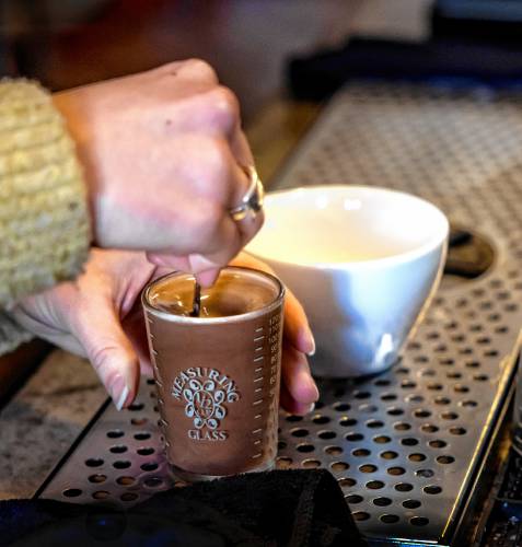 Revelstoke Coffee chef lead Jordan Campbell stirs in steamed milk into the mocha to make the hot coco on Wednesday, January 22, 2205.  Winter Fest, a staple of January in Concord for the past seven years, will now have a a hot cocoa tour.