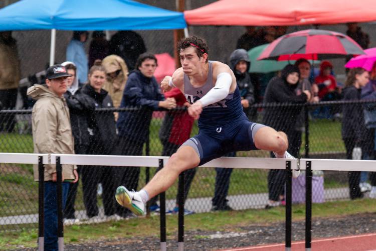 Merrimack Valley’s Mychal Reynolds races in the 110-meter hurdles at the Black Bear Invitational at Coe-Brown Northwood Academy on Saturday. Reynolds finished third in the 300 hurdles, sixth in the 110 hurdles and anchored MV’s third-place 4x400 relay to help the Pride win the Black Bear team title. MV topped a field of 29 teams.